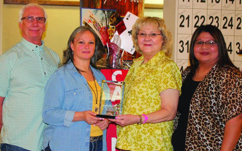 Business of the Year - Brady’s Package Store. Standing left to right are Gregg Tidmore, Cha’la Cimental, Wendy Tidmore, and Antonia Rivera.