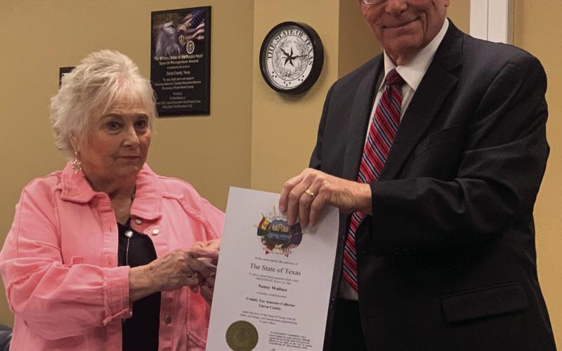 STATE OF TEXAS Garza County elected officials received their State of Texas certificates during the regular commissioners meeting on Monday, Feb. 10. Pictured is Tax Assessor Collector, Nancy Wallace and Judge Lee Norman. | ANNA GIBSON PHOTO