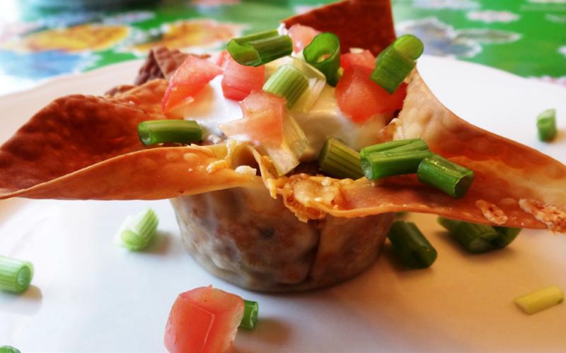 PARTY PREP Taco cups in muffin tins can be created by brushing egg-roll or wonton wrappers with oil to crisp in the oven, eliminating the need to for deep frying. | ANGELINA LaRUE PHOTO