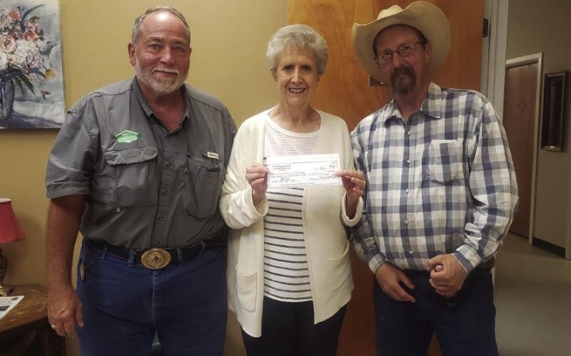 FUNDRAISER Masonic Lodge 2058 of Post presents a check to Garza CountyTrailblazers in the amount of $4,068 to help with the replacement of an air conditioner for the center. Presenting the gift to LaGayluah McReynolds are David Clark, currentWorshipful Master, and MarkWheeler, past Worshipful Master, of Masonic Lodge 2058. The gift is the result of a raffle fundraiser held by the lodge over the last three months. | COURTESY PHOTO