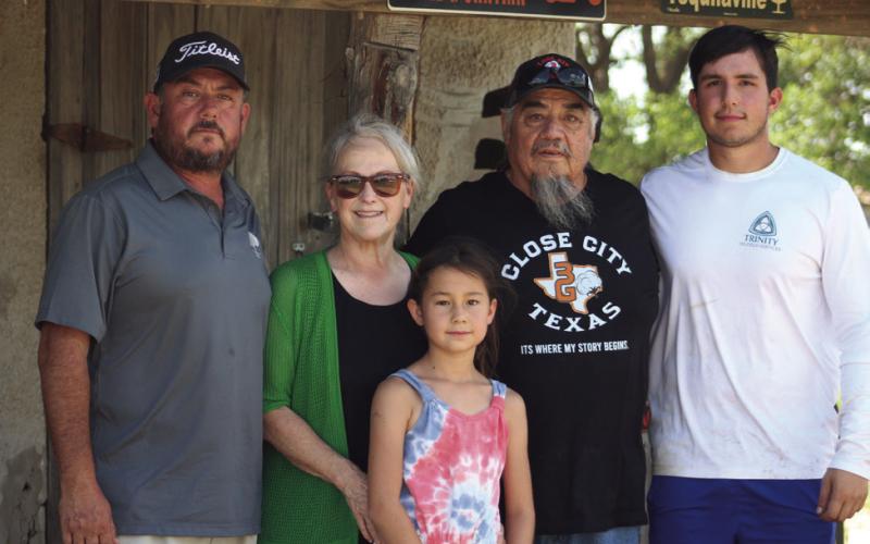 FARMERS HELP The Gonzales family was on the receiving end of their neighbors' help this past week when farmers showed up to work the fields. This family is waiting for the group to finish from the left Steve, Susan, Sophia, Danny and Stevie. | STAFF PHOTO