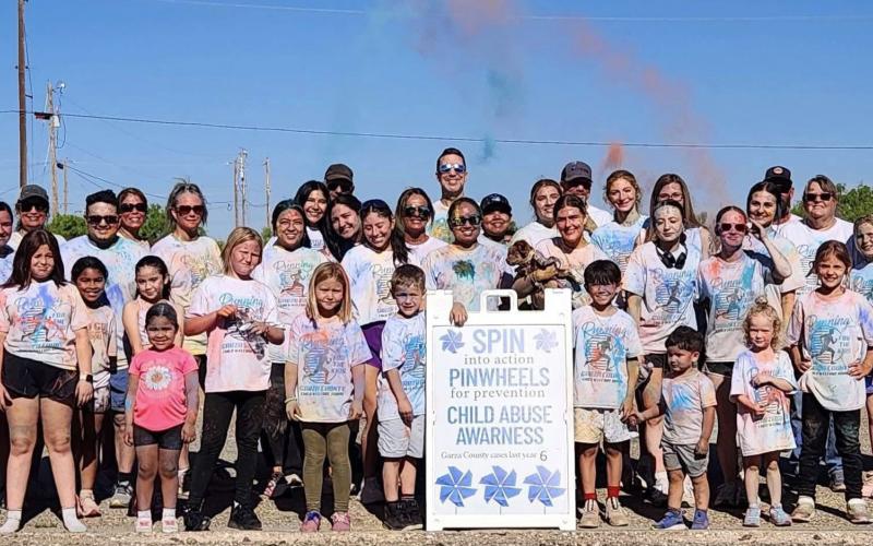 CHILD ADVOCACY Participants gather after the Garza County Child Welfare Board’s inaugural Color Run in Post, covered in colored powder following the race to raise awareness for child abuse prevention. SEE MORE PHOTOS PAGE 8 | COURTESY PHOTO