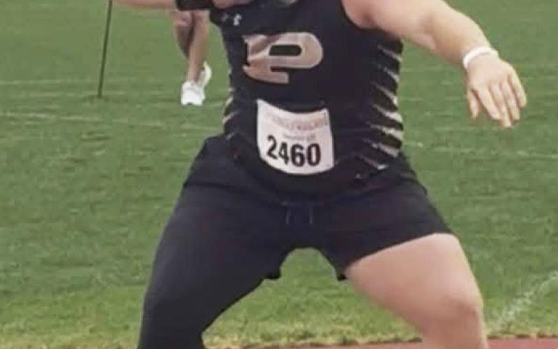 ELITE THROW Mason Wright prepares to release a shot put at the Texas Relays on April 4 in Austin. | COURTESY PHOTO