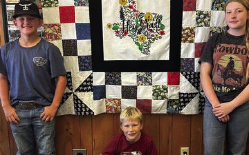 QUILTING Friday, October 11, Kye, Rein, and Connor completed the top of the quilt for the GCJLA Homemaking division. Raffle tickets will go on sale soon. | XANE RIETER PHOTO