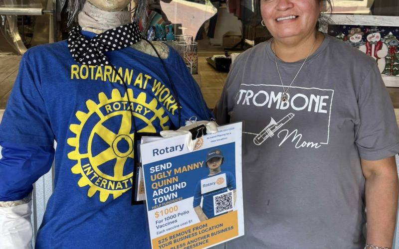 UGLY MANNY QUINN posed recently at her final 2025 stop, sporting a new hat from Kingdom Tire outside Post Family Cleaners. | COURTESY PHOTOS