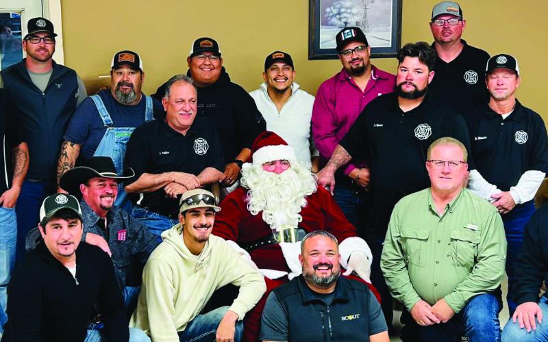 SANTA VISIT Santa made a special visit to the Post Volunteer Fire Department during their annual Christmas part last week. The department met at Garza County Trail Blazers for a meal before receiving their annual check for the calls they attended during the year. | COURTESY PHOTO