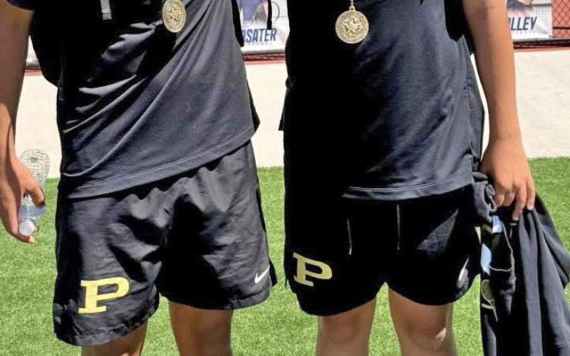 BOYS DOUBLES Champions Ryy Ryan, left, and Sawyer Mackey secured the boys doubles championship at the district tennis tournament. | COURTESY PHOTO