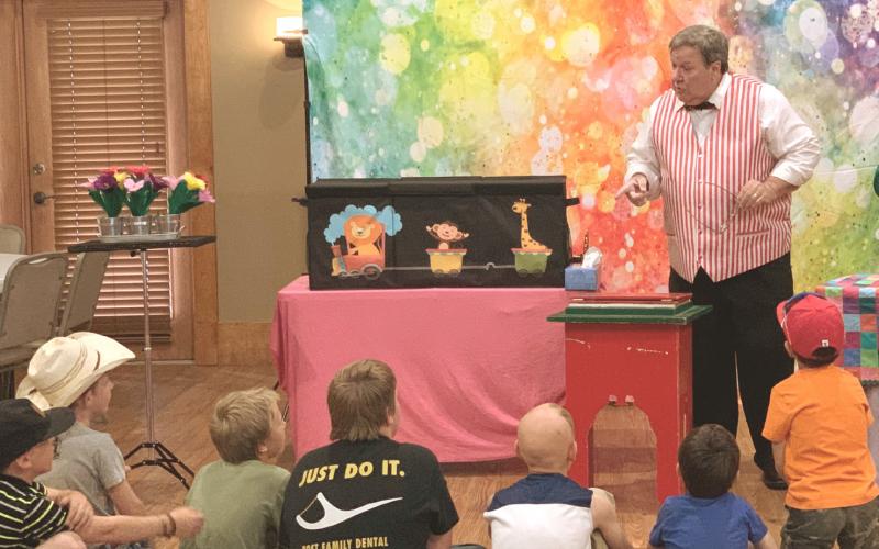 LIBRARY MAGIC The Post Public Library held a special event with“Rick the Magician”during the summer reading program at the Heritage House last Tuesday. MORE LIBRARY FUN AND GAMES, PAGE 3 | POST DISPATCH