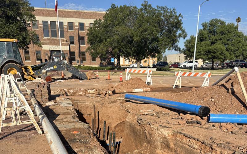 WATERLINE SOLUTION Pipe and valves lay exposed near the Garza County Courthouse as city crews and contractors worked through multiple complications to repair an unexpected leak Monday night. Officials say some lines were not documented on city maps, forcing crews to dig, locate and improvise solutions before repairs can be completed. | POST DISPATCH