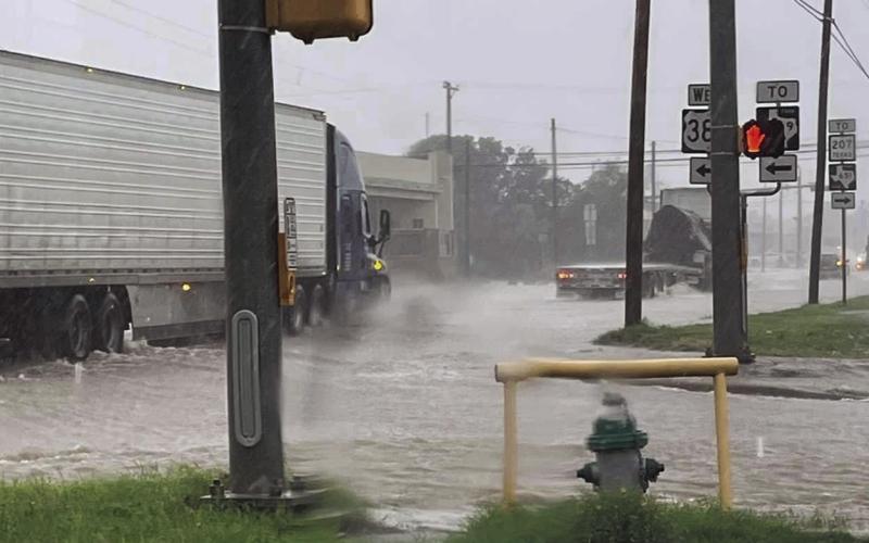 This photo was taken at the intersection of US 84 and West US 380. Wakes caused by traffic driving through the flooded streets caused flooding issued for businesses located on Broadway. Photo Provided