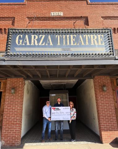 SUPPORTING ITS SECOND CENTURY The Garza Theatre, purchased by Jesse Dixon and Perky Palette two years ago after sitting vacant for a decade, is on its way to a fresh lease on life thanks to seed gifts such as Poka Lambro’s donation earlier this month. Poka Lambro CFO Matt Snowden made the presentation to Angela Dixon and Sean Robertson, Perky Palette representatives. | COURTESY PHOTO