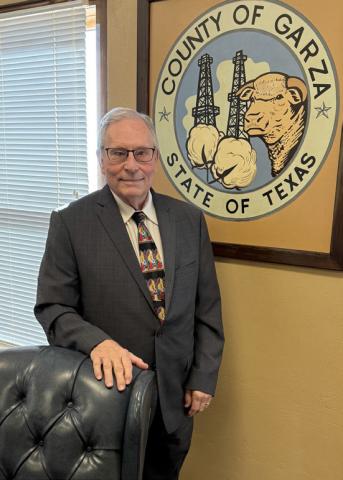 LONGTIME LEADER Judge Lee Norman stands in front of the Garza County Seal as he enters his final year in office, capping nearly two decades of dedicated service and community leadership in West Texas. | STEPHANIE ALLEN