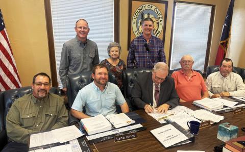 COURT PROCLAMATION Garza County Judge Lee Norman signs a proclamation declaring Soil Stewardship Week as Drew Kirkpatrick, Helen Saldaña and Kegan Crouch joined county commissioners for the presentation and signing during commissioners court April 13. | POST DISPATCH