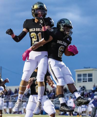 Sophomore Ian Vergara (6) celebrates with Junior Colin Carson (21). Vergara had two touchdowns and Carson had one touchdown in the district-opener loss to Olton. Photo by Ron Francis