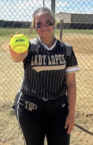 Post Lady Lope Zailey Perez poses with the game ball after hitting her first home run of the season during the Lady Lopes’ district game against New Home. | COURTESY PHOTO