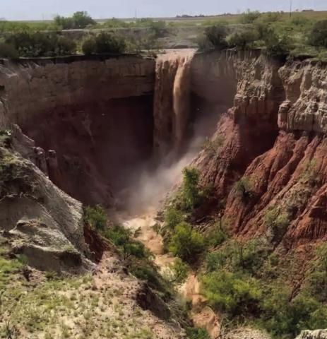 During the torrential rains last week, a waterfall was created by the runoff water from fields on 380 West. As the water swept through cotton fields and pastures, the final destination was the waterfall on the caprock created by the rains that brought 3.5 to 5.5 inches to the area. Photo by John David Fields