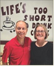COFFEE WIZARDS Jeff and Dawna Hood, owners of Coffee Wizards, are celebrating the fifth year on North Broadway with a community giveaway on Monday, June 9. Stop by to spin the prize wheel, enter to win merch, and catch the live drawing on Facebook at 3 p.m.! See the article for details. | COURTESY PHOTO
