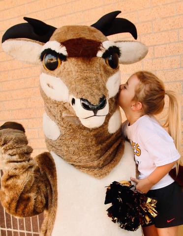 Oscar is gearing up for the 2023 Football Season. Kennedy Beck, a mini-cheerleader, is definitely in love with Oscar. They will be on the field cheering on the Bold Gold Antelopes in an upcoming game. | WHITNEY DORSETT PHOTO