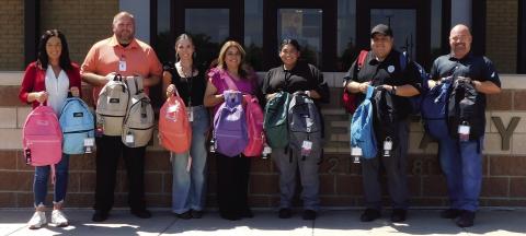 BACKPACKS Employees with Management and Training Corporation (MTC) delivered backpacks to Post Elementary last week. Twentyone backpacks were delivered filled with school supplies. Picture from the left Shawn Lamb, Elementary Principal, MTC Captain David Dyer, Stephanie Valdez, Elementary Social Worker, MTC Admin. Assistant Teresa Gomez, SIS Marina Abrera, SIS Joe Ramirez and Joey Hannaway, Elementary Assistant Principal. | PHOTO PROVIDED