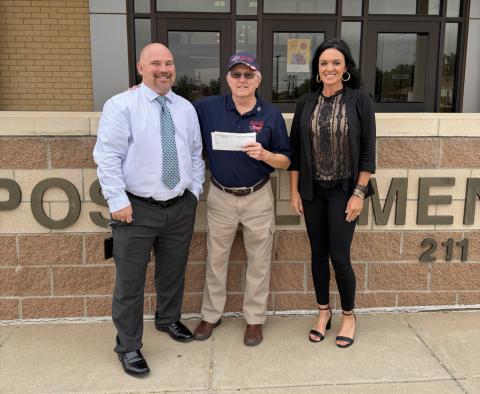 GIVING BACK Larry Williams (center), representing the Texas South Plains Honor Flight, accepted a donation check from Assistant Principal Joey Hanaway and Principal Shawna Lamb during a presentation May 20 at Post Elementary School. | STEPHANIE ALLEN