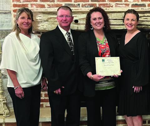 HONORED Kerry and Kristi Wink were presented as the District 2 Garza County 4-H Distinguished. From left to right: Danya Peterson, Garza County Extension, Kristi and Kerry Wink, and Xane Reiter, Garza County Family and Community Health Agent. Also attending the event were County Judge Lee and Marsha Norman, and Carol Williams. | PHOTO PROVIDED