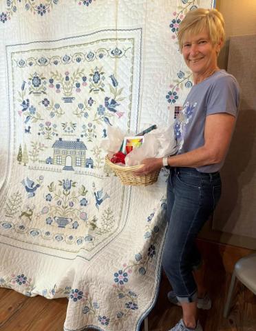 PEOPLE’S CHOICE Joann Travis took the People’s Choice award for her cross-stitch quilt, which she made in her twentiess and was later quilted by a neighbor, during the Garza County Quilt Show on Saturday, May 2, in Post. | COURTESY PHOTO