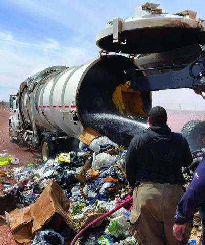 Post Volunteer Fire Department is shown spraying water on a trash fire contained in the city’s garbage truck. The truck is a total loss. Photo Provided