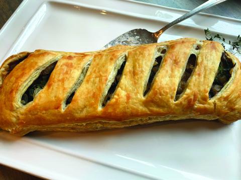 MUSHROOM WELLINGTON is a culinary delight you won’t want to miss! This dish beautifully combines earthy, rich mushrooms with a flaky, golden pastry that envelops a rich filling, creating a comforting yet sophisticated dining experience. | ANGELINA LARUE PHOTO