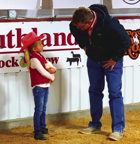 CHICKEN SHOW Pee-Wee Ellisyn Johnson opened the Southland Junior Livestock Show by showing her hen named King Bob last Saturday, Jan. 4. The Junior Livestock Show winners circle records and photos from both Southland and Post will be published in the Jan. 17 issue. | ANNA GIBSON PHOTO
