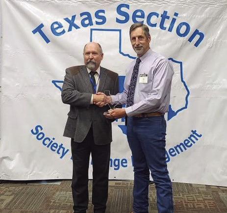 NCRS HONORS Doug Tolleson, President of the Texas Section Society for Range Management (TSSRM), presents the 2023 Grass Roots NRCS award to Range Conservationist Glen Killough of Post, Texas, at the TSSRM annual meeting held in Bastrop, Texas. | COURTESY PHOTO