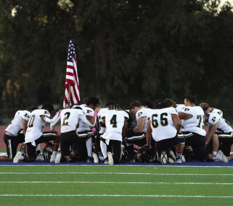The Bold Gold Antelopes take a moment of silence before facing the Sundown Roughnecks in Week 9 action last Friday.