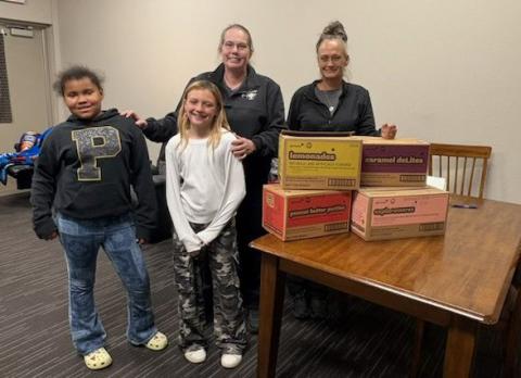SWEET THANKS Dezariyah Spann and Averie Howell presented Girl Scout cookies to Post EMTs Amanda Hair and Mandi Thompson April 20 as a token of appreciation for their service. See more photos on page 4. | COURTESY PHOTO