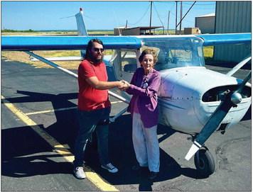 Dillon C. Lloyd is with Designated Pilot Examiner Rosemary Stidham and received his private license this week. Lloyd is the first graduate of the US Flight Academy in Post. PHOTO PROVIDED