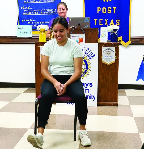 POST ROTARY CLUB Rotary member Dr. Xochitl Anderton and her college senior daughter Addie Anderton presented the importance of stretching exercises and maintaining mobility. Addie demonstrates ankle circles, ABC style. | DISPATCH PHOTO