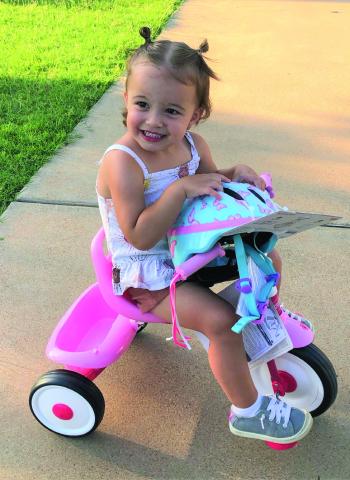 Chole Davis won a new tricycle from the Community Recovery Center for the best-decorated entry in the Bike Parade held on July 4.