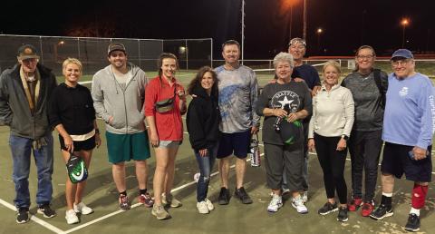 Pickleball players stopped long enough on Monday night for a quick photo. Pictured left to right are Wes Callen, Rhonda Valdez, Trevor and Lindsey Leggett, Debbie and Marcus Owen, Barbara and Charles Hardin, Ruth Torrens, Kary Callen, and George McDonald. Everyone is invited to join the charter members of the Post Pickleball Club each Monday and Thursday at the PISD tennis courts. Photo by Ian Torrens