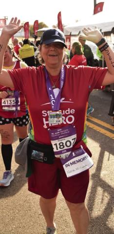 Virginia, a St. Jude Hero, is displaying the names of Nora and Stella on her arms as she prepares to run a 10K at Memphis. Photo Provided