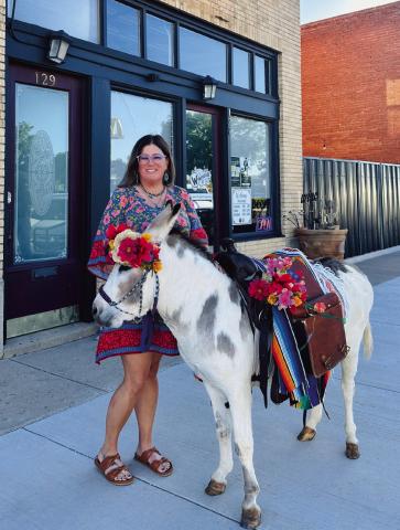 BIRTHDAY DONKEY Whitney Dorsett was surprised with a party for her 40th birthday by her husband and the help of her friends. Together they bought Senior Carrots. Courtney Howard decorated and made the flower crown for the donkey and Lacy Beck brought the donkey to town. Michele Liston was accommodating to allow Senior Carrots into the Winehouse! | COURTNEY HOWARD PHOTO