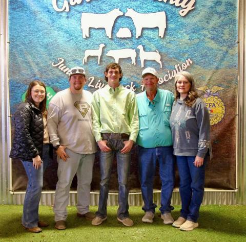 CHUCK AND KRISTI MORRIS with their children at the 2026 Garza County Junior Livestock Show in Post. The family has received widespread community support after a house fire destroyed their home on Jan. 15. | COURTESY PHOTOS