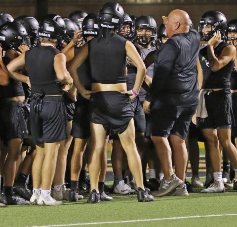 Head Football Coach John Wright addresses the students suited up for the beginning of the 2023 football season. | PHOTO BY ABIGAIL RODRIGUEZ