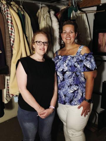 PASSIONATE ARTISTS Angela Dixon (left) and Katie Mitchell are shown standing in a closet filled with costume coats from the productions that once took place in the Garza Theatre. Their ambition is to preserve the history and renovate where needed to open the doors once again! | ANNA GIBSON PHOTO