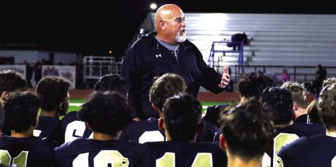 BI-DISTRICT CHAMPS Head coach John Wright commends the team after a 'tale of two sides' type of game. | KHLOE SMITH PHOTO