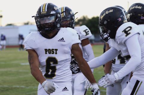 DISTRICT BEGINS Teammates congratulate junior IanVergara on his return to the field and his touchdown to put the Antelopes ahead of the Olton Mustangs 8-0 only three minutes into the first quarter. | ABIGAIL RODRIGUEZ