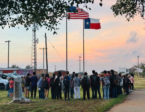 Southland ISD students gather in prayer before school Wednesday, Sept. 23, as part of See you at the Pole, an annual student-led prayer event held at school flagpoles across the country. | JENNIFER HOGAN