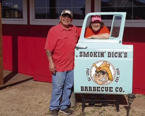 BARBECUE HAVEN Dick and Shellee Odom stand beside their restaurant sign with great big smiles after their newly constructed addition to Smokin’Dick’s Barbecue. They will celebrate their third year on Feb. 14 with a pork chop meal deal from 11 a.m. - 6 p.m. | PAUL GIBSON PHOTO