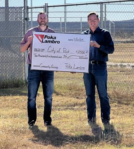 PLAY BALL! Post city manager Rhett Parker (right) recently accepted a donation of $2,500 from Poka Lambro for enhancement of the city’s baseball facilities. | COURTESY PHOTO