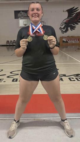 DOUBLE GOLD Audrey Lee of Southland High School celebrated a dominant performance at the district track meet, earning gold in both the shot put and discus to advance to the area competition. | COURTESY PHOTO