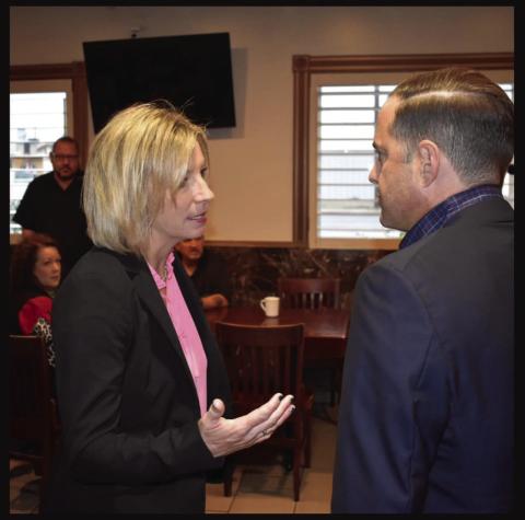 Post ISD Superintendent Cassie Petty visits with Rep. Dustin Burrows on issues involving education. Photo Provided