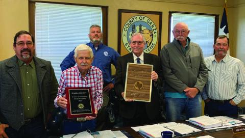 AWARD PRESENTATION, Steve Owens (in the back) from the Texas Association of Counties presented Garza County with the Safety Achievement Award and a plaque in Recognition for their 50 years of membership. Commissioners’picture from left to right are Giles Dalby Jr.,Ted Brannon, Judge Lee Norman, KimWilks, and Jeff Williams. | ANNA GIBSON PHOTO