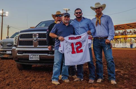Courtesy Photo Rodney Tidwell received the '12th Man' award from Randon Blacklock, owner of Premier Autos of West Texas. Rodeo board members Wacy Moore and Miles Underwood were present for the award. Rodney is Director/Paramedic at Post-Garza Co EMS.